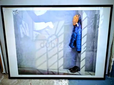 Beautiful Framed Artwork Featuring a Blue Jacket and Yellow Cap