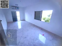 For annual rent: a two-bedroom apartment with a living room and an open view of Ajman Corniche.