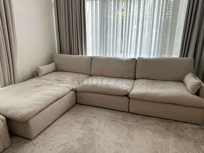Home centre 4 piece beige color sofa with footstool