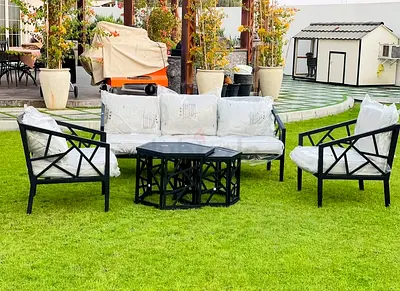 Elegant black metal outdoor seating set with 2 tables
