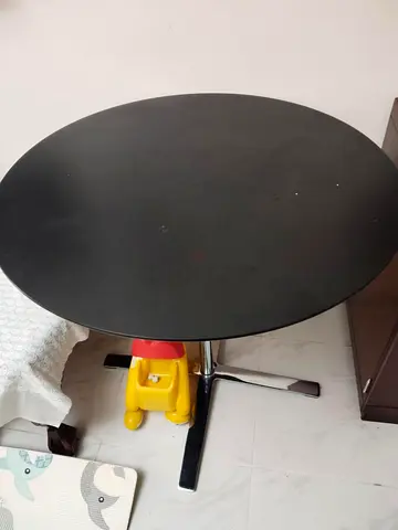 Modern Round Black Dining Table with two rotating cozy chairs