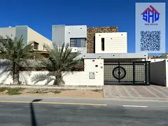 Residential and commercial villa for rent in Al Mowaihat Five council rooms, a hall and a maid's
