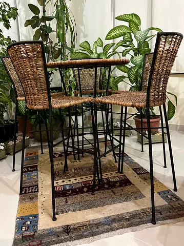 High stools with a high table in and outdoors
