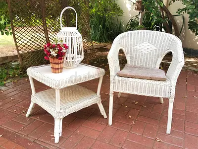 Charming White Wicker Patio Chair and Table Set.