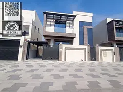 For sale in Al Bahia: a villa with 5 master bedrooms, a majlis (formal sitting room), two living roo