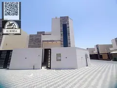 For sale: Corner villa in Al Helio 2, Ajman, consisting of 4 master bedrooms, a majlis, a living roo