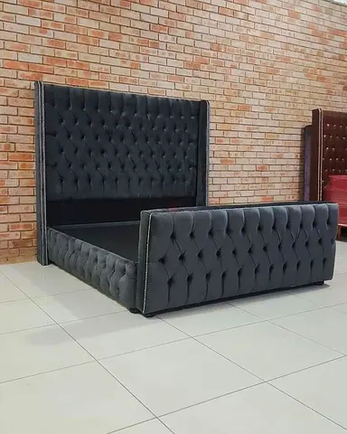 Elegant Black Velvet Bed with Tufted Design