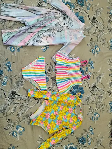 All for 40 AED only Swimming costume 1 new another 2 just one time used Good for 4-6 years old girl