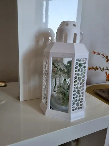 Elegant White Lantern with Floral Display
