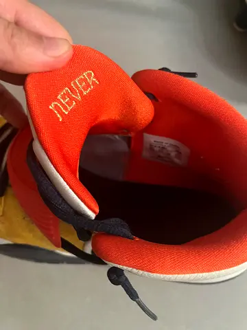 Kyrie Irving basketball shoes featuring signatures from NBA stars Rudy Gobert and Mike Conley.