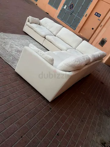 Comfortable and Inviting L-Shaped Sofa in Cream Color