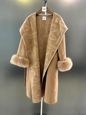 Hermes-branded wrap coat with fur cuffs.
