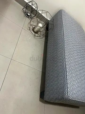 Stylish Upholstered Ottoman with Geometric Pattern