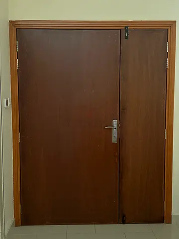 A wooden double-leaf door