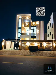 A luxurious modern villa in Al Helio 2 area - Ajman, featuring a luxurious design and high-quality f