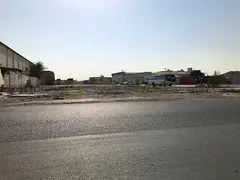 commercial land on main road for sale in Al Nahdha - Al Darari area