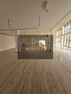 8300 sq ft showroom with mezzanine and outdoor setback for rent in Al Jurf Industrial 3, includes 4