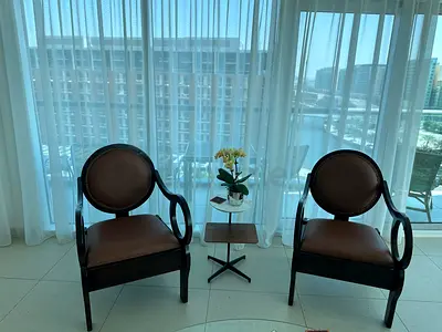 Two elegant wooden and leather armchairs in very good condition.