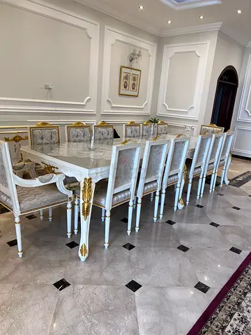 Elegant Dining Table Set with Exquisite Detailing new condition white and gold color fabric very exp
