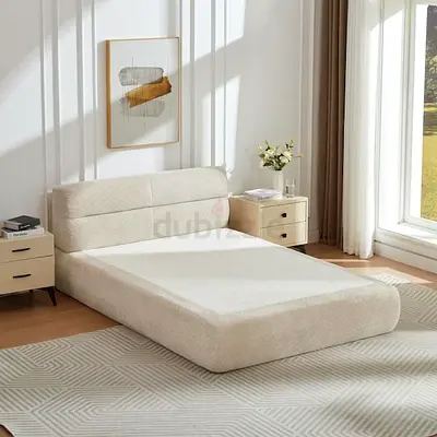 *Minimalist White Upholstered Bed with Elegant Line Art Accent*