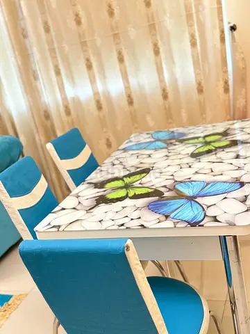Charming Dining Table with Butterfly Design