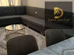 Two bedrooms and a living room / Furnished with hotel-style furniture / Al Taawun