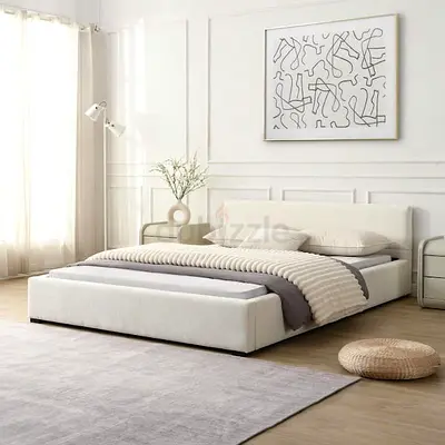 *Minimalist White Upholstered Bed with Elegant Line Art Accent*