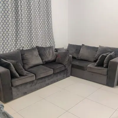 Comfortable Grey Couch for Sale slightly used and in good condition .