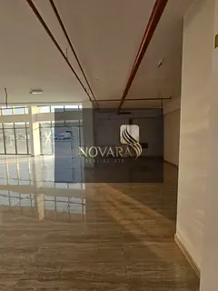 A spacious 8,300 sq ft showroom with a mezzanine and usable outdoor setback,