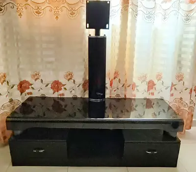 Wooden TV stand with glass top