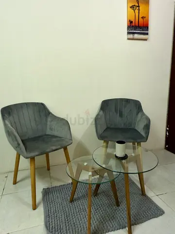 Elegant Glass Top Coffee Table with Stylish Chairs