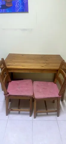 Sturdy Wooden Dining Table with Pink Chairs