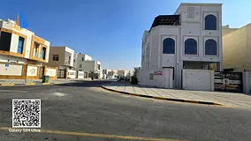 Corner villa, freehold, open to all nationalities. Prime location in Al-Amirah, on a main road, clos