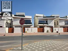 For sale in Al Helio 2, Ajman: a villa with 5 master bedrooms, 3 living rooms, and a spacious majlis