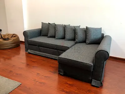 IKEA Lshape sofa com bed with storage dark gray color