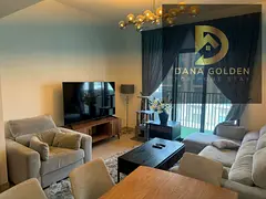 One bedroom and living room with pool view and balcony, furnished with hotel-style furniture, Maryam