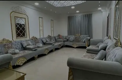 Elegant Grey Sofa Set with Decorative Pillows