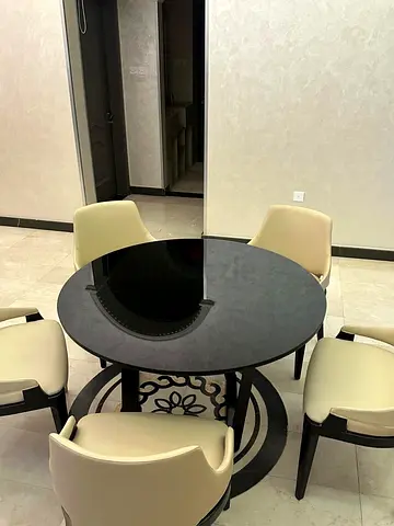 Elegant Round Dining Table with Stylish Chairs