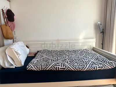Stylish and Comfortable Bed. Simple white and easy to fit into any room. Also called a couch bed.