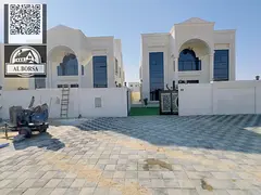 For sale in Al Helio 2, Ajman: a villa with 5 master bedrooms, a majlis, two living rooms, a kitchen