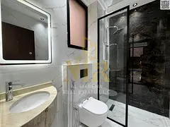Luxury super deluxe villa for sale in Al Zahiyah area, Ajman, with a swimming pool, two floors and a