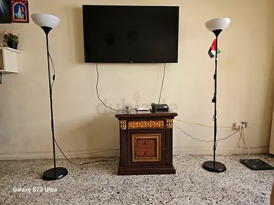 Charming Entertainment Center with Stylish Floor Lamps