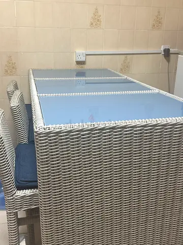 Elegant Outdoor Dining Table with Rattan Weave