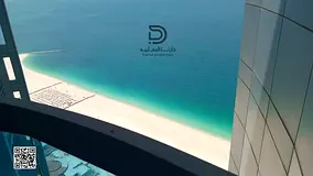 Own a spacious 2-bedroom apartment in Corniche Towers with a stunning sea view and a prime location