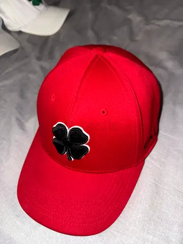 Stylish Red Cap with Embroidered Clover Design