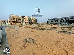 Own a plot of land in Al Helio 2, Ajman, in a prime strategic location directly on Sheikh Mohammed B
