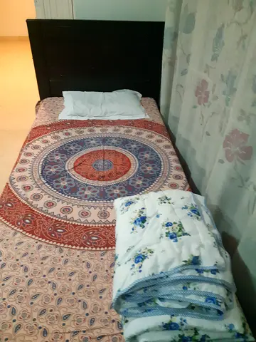 Comfortable single Bed with Elegant Bedding