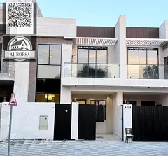 For sale in Al Yasmin: Townhouse with 4 bedrooms, living room, and sitting room.