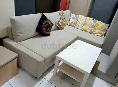 Comfortable L-Shaped Sofa with Decorative Cushions