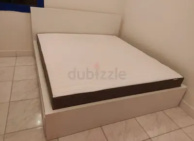 IKEA queen‑size bed (160 × 200 cm) with 2 storage drawers underneath and an IKEA mattress